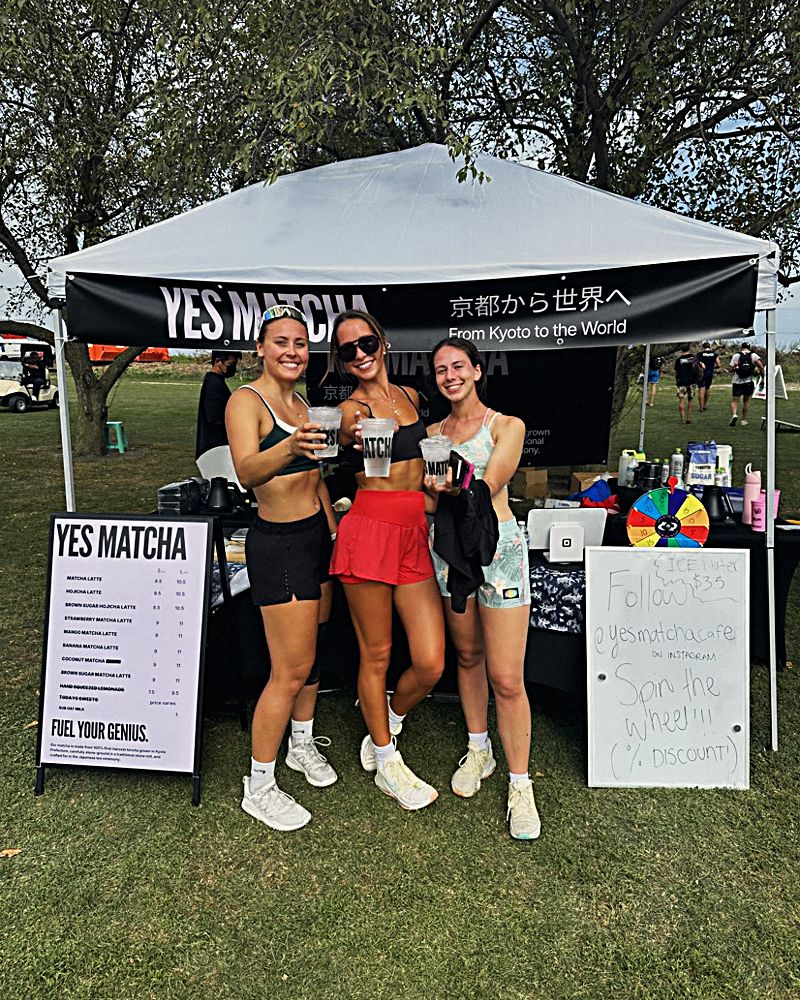Three friends at the YES MATCHA tent at the Chicago Luau