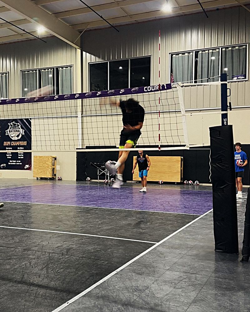 A player going up for a spike